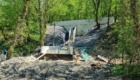 Общий вид на подпорную стену, восстановленный водопропуск и построенный быстроток